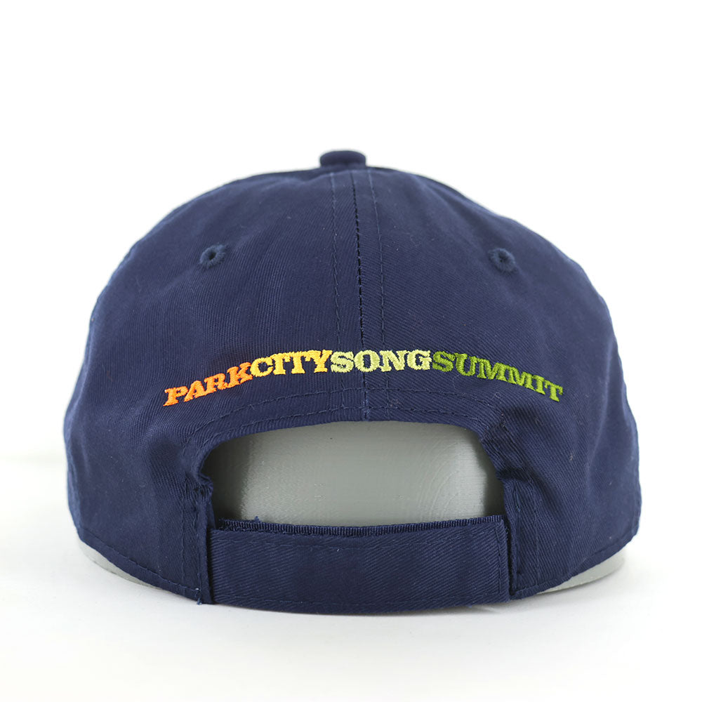 Navy blue cap with colorful Park City Song Summit logo embroidered on the back of the hat